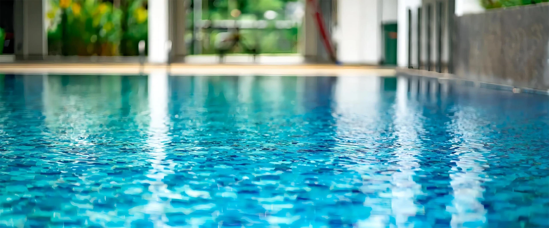 The shimmering swimming pool water surface