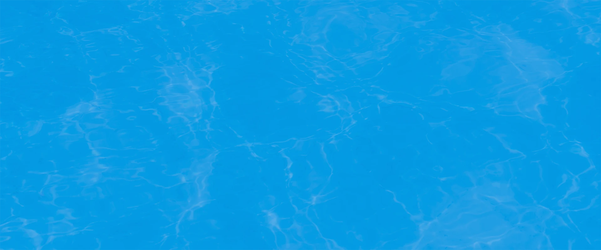 The shimmering surface of a swimming pool under a blue filter.