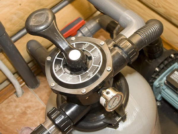 Sand filter tank pool pump with multiport valve is working.